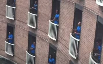 Equipa de rugby das ilhas Fiji em quarentena canta nas varandas de hotel