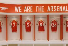 Arsenal FC jerseys on display in the Emirates Stadium locker room, London.