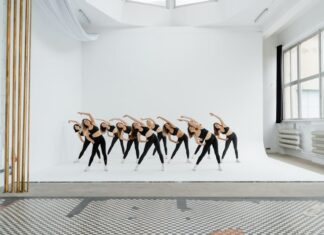 Group of women exercising in a bright studio space. Perfect for fitness and lifestyle themes.