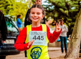 Young girl participating in a vibrant marathon event, showing enthusiasm and energy.