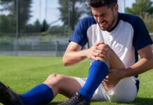 Adeptos a acompanhar um jogo de futebol