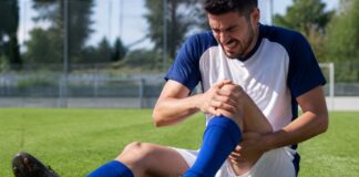 Adeptos a acompanhar um jogo de futebol